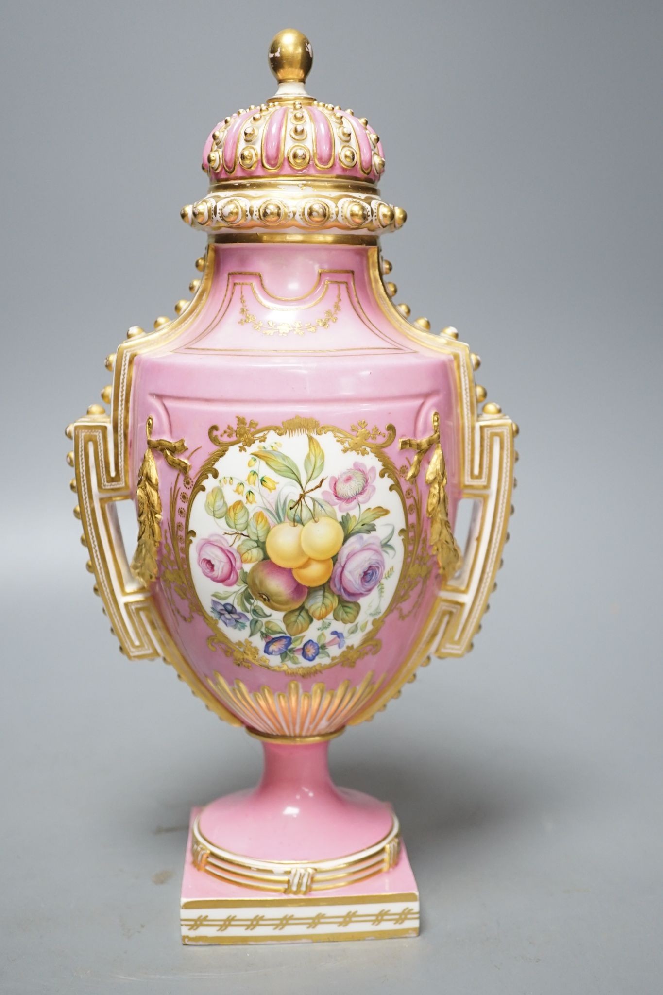 A Coalport two handled vase and cover painted with a Watteauesque scene to one side and a panel of fruit and flowers by William Cook 31cm